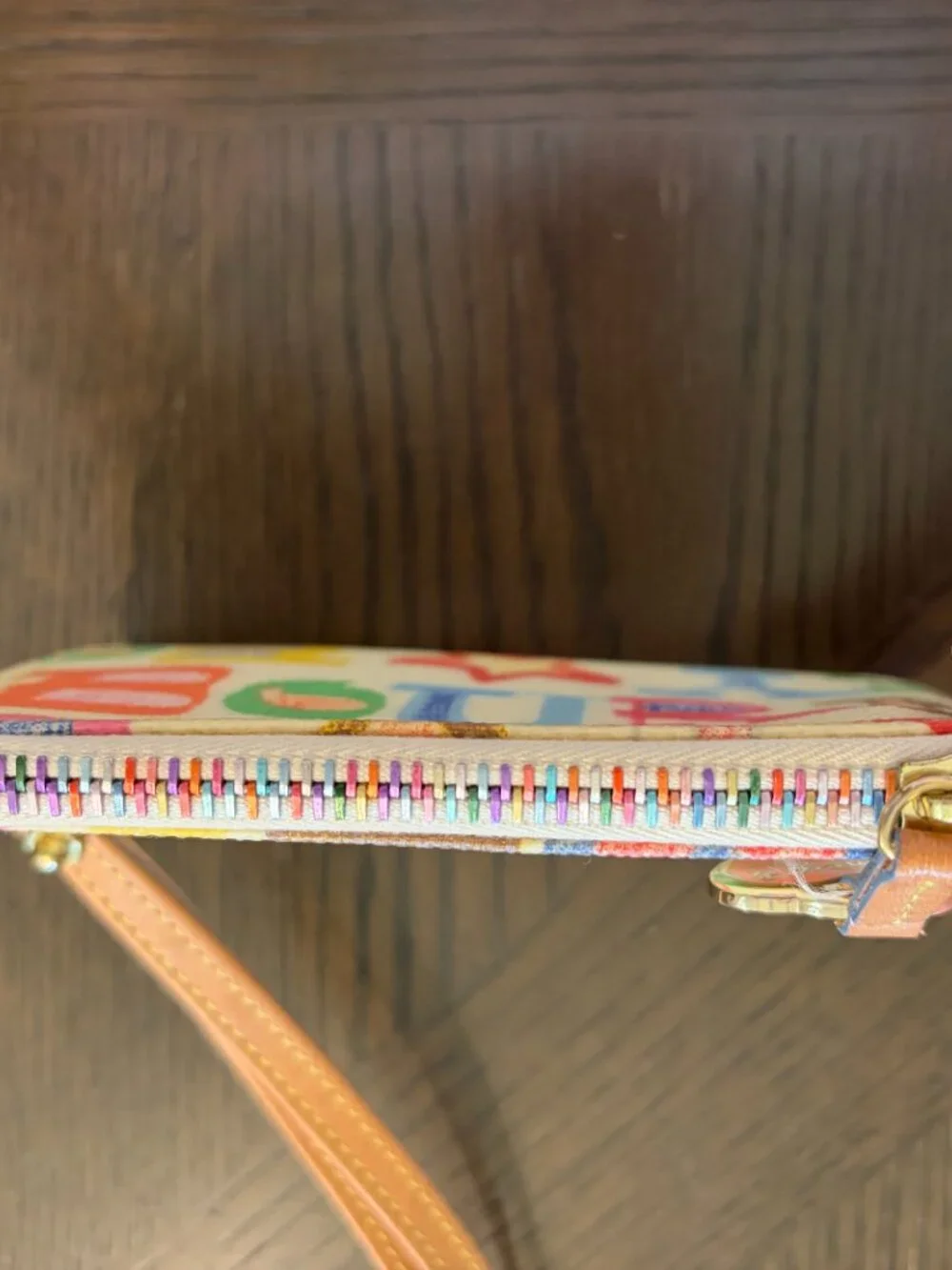 White Dooney & Bourke Wristlet with Multicolored Decor